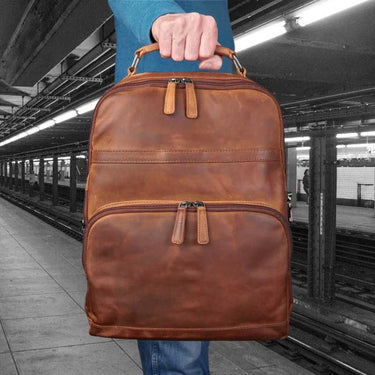 man-in-subway-holding-ccw-quinn-leather-ccw-backpack